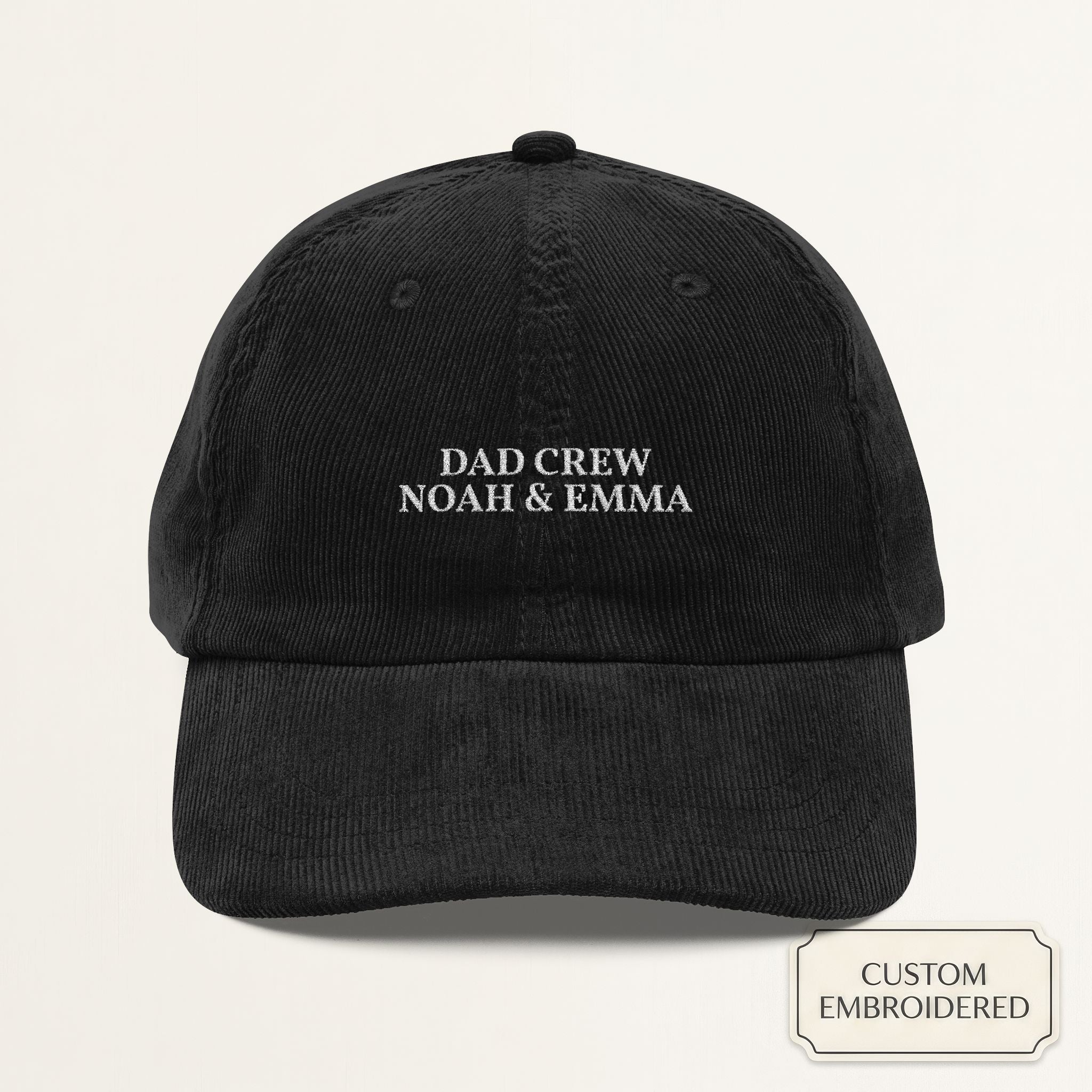 Black corduroy dad cap with off-white embroidered DAD CREW and personalized kids names on the front panel