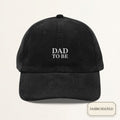 Black corduroy cap with DAD TO BE off-white embroidery — front view