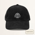Black corduroy dad cap with small off-white embroidered ROOTED IN FAMILY text on the front panel