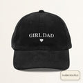 Black corduroy dad cap with small off-white embroidered GIRL DAD text and heart on the front panel