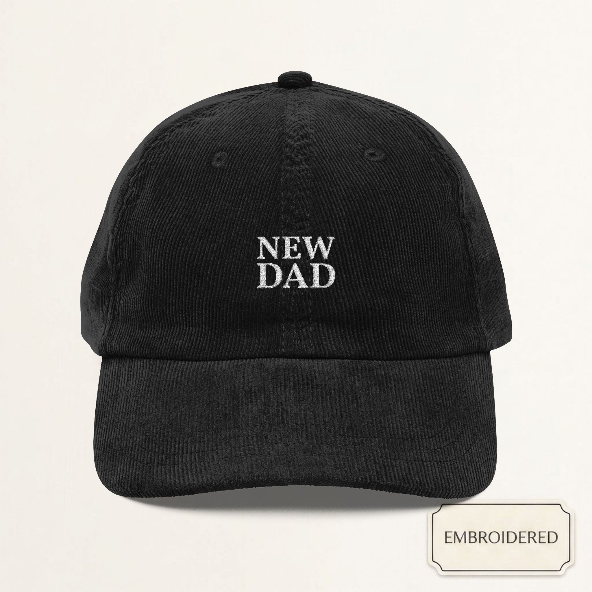 Black corduroy dad cap with NEW DAD off-white embroidery — front view